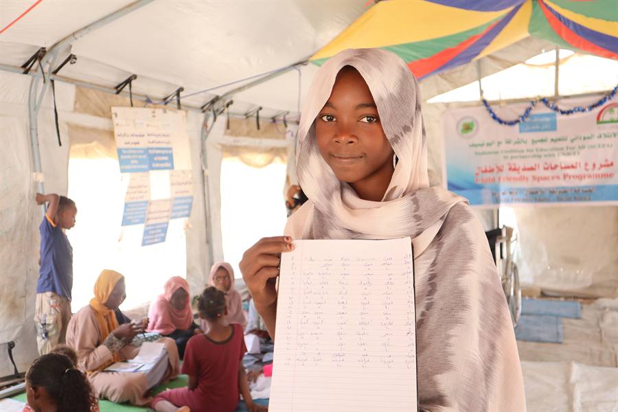 Children gather in a child-friendly space set up as part of an emergency response.